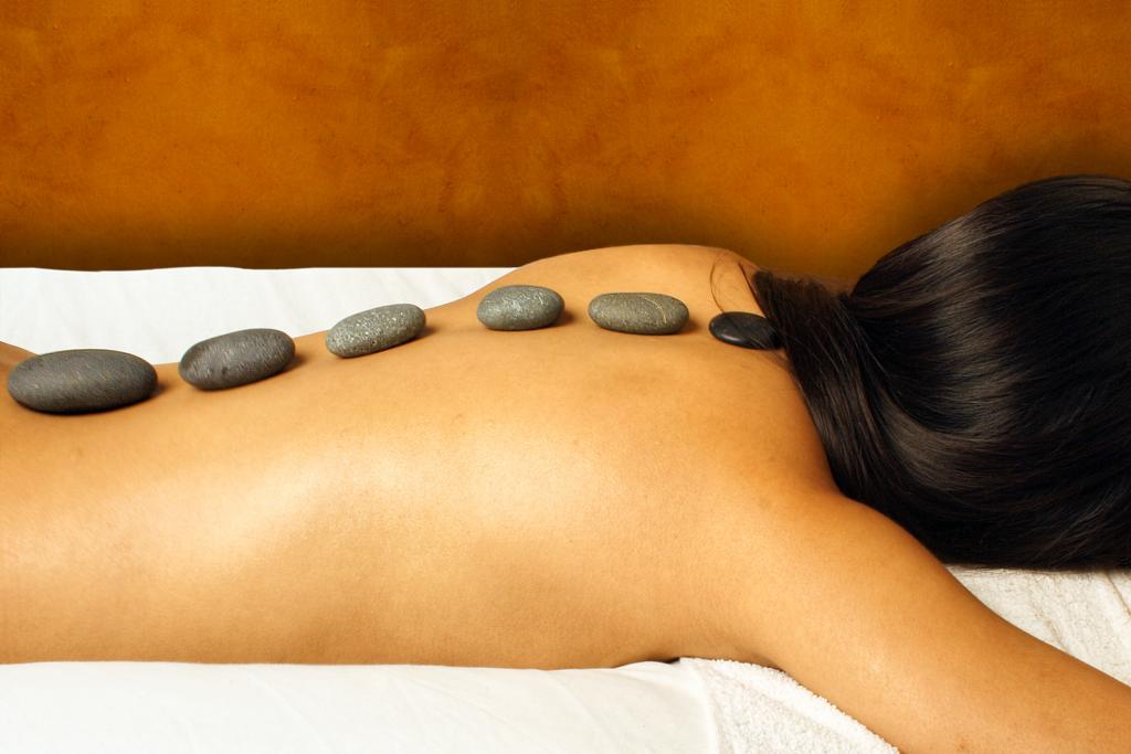 Hot stone massage on a woman